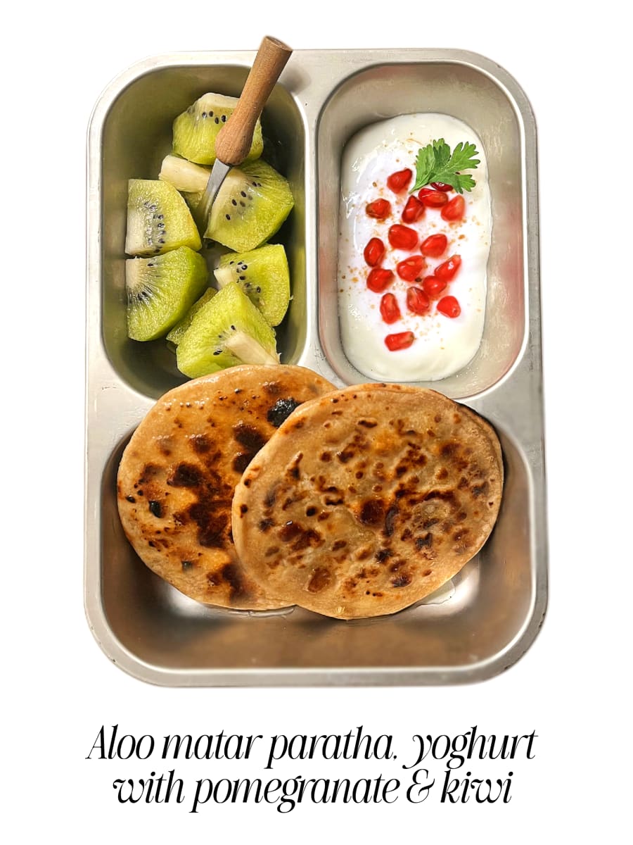 Lunchbox: Aloo matar paratha with yoghurt, pomegranate and kiwi